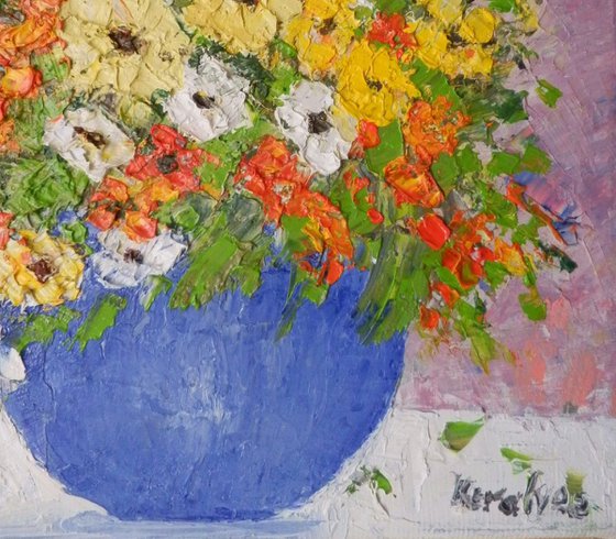 Blue bowl with multicolored flowers