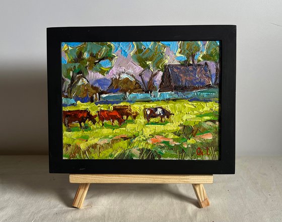 Cows on a green field