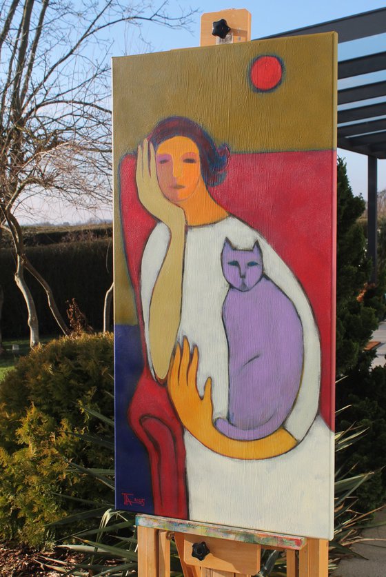 Portrait in a red chair.