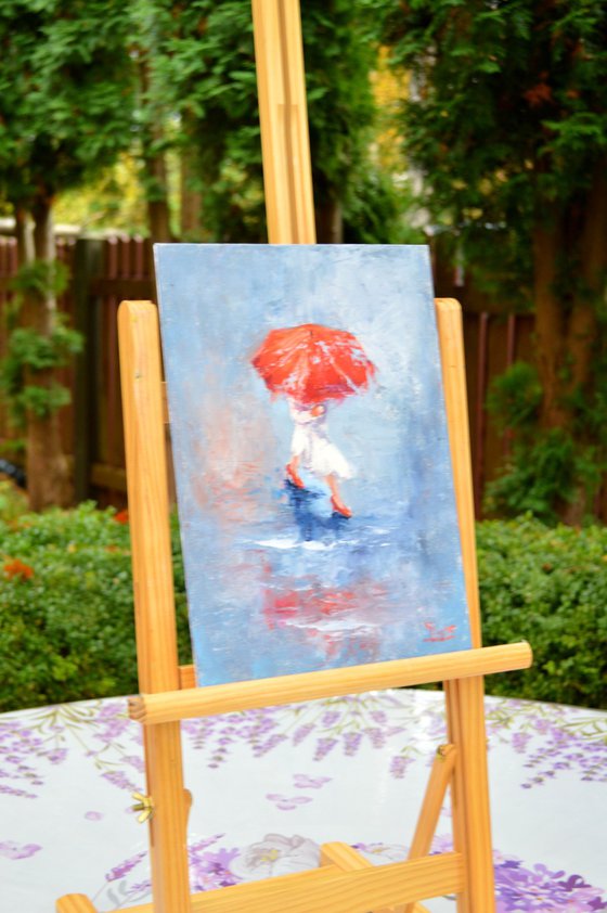 A girl running through puddles