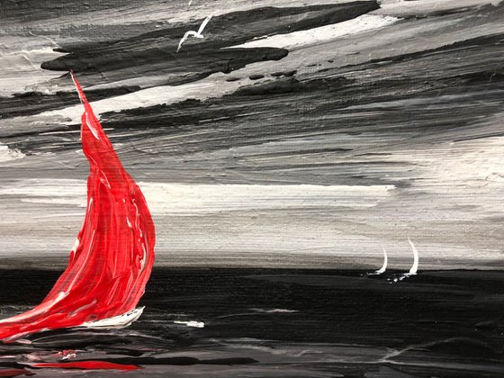 Red sail in a storm