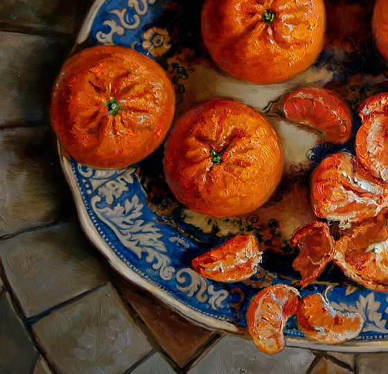 Tangerines on a blue plate