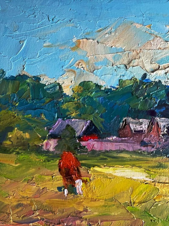 A Red Cow near the Houses