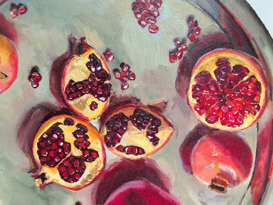 Pomegranates on metal try