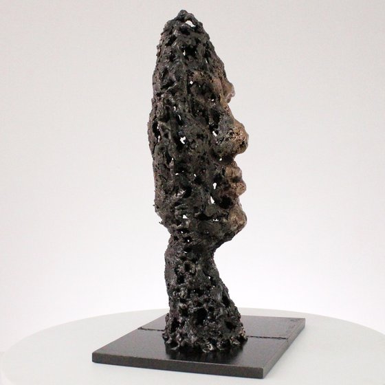 A rock - Face sculpture bronze steel