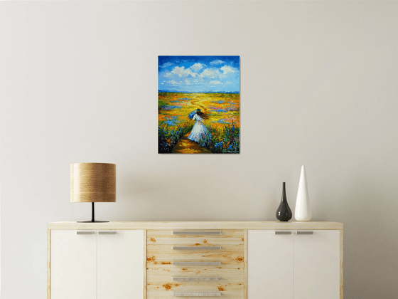 Woman Walking Through a Flower Field