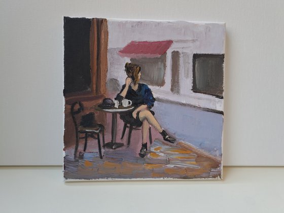 A woman in French cafe