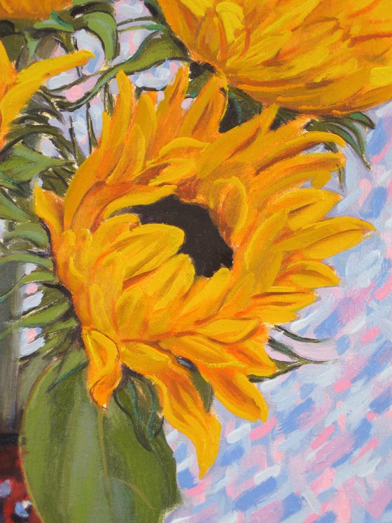 Four sunflowers in a vase