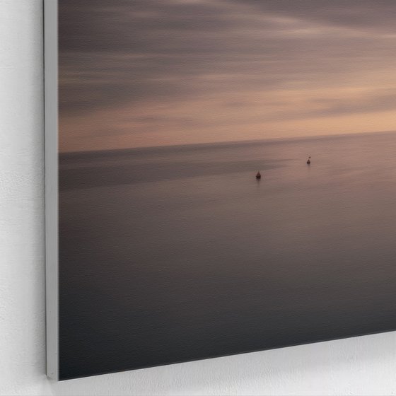 Four buoys at sunset