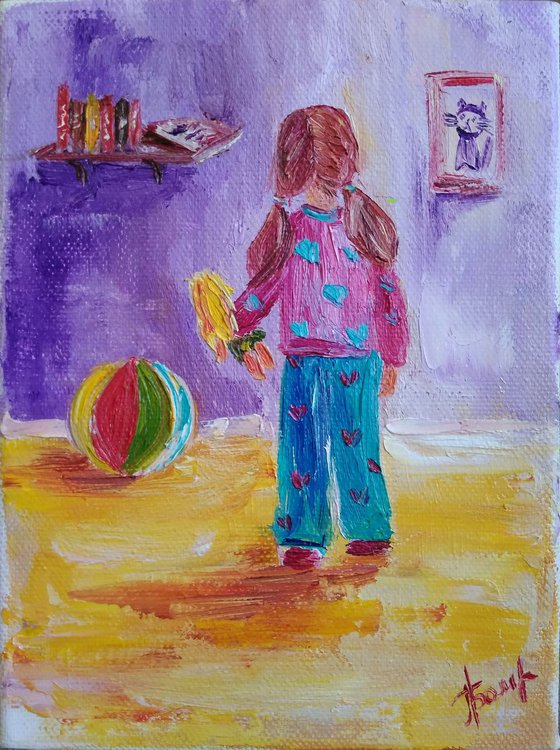 Little girl in her nursery room
