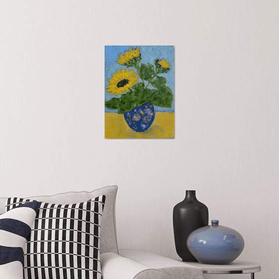 Sunflowers in blue vase