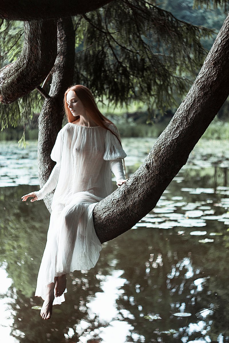 A mermaid sits among the branches by Alexandra Bochkareva