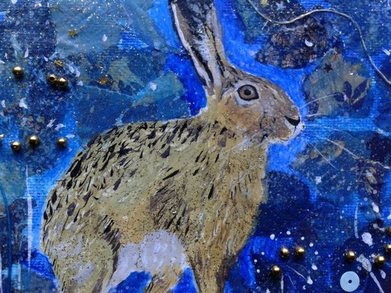 Hare poised under the moon