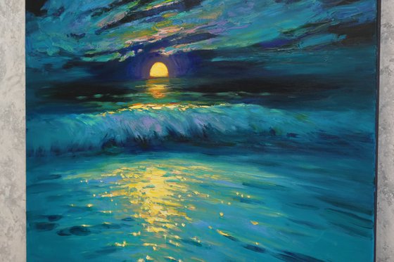 Moonrise in blue over sea