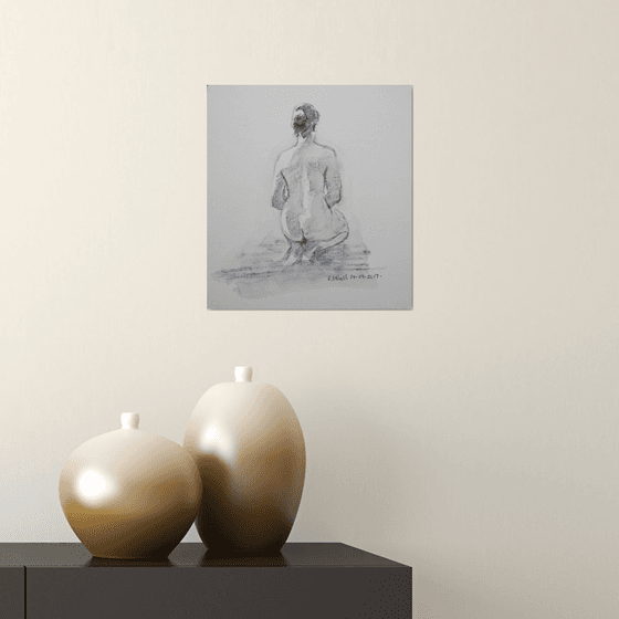 Seated female nude back view