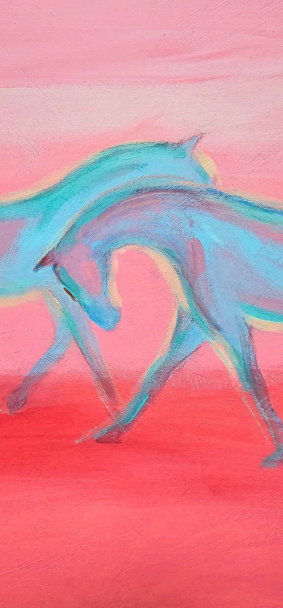 White blue horses at soft pink sunset