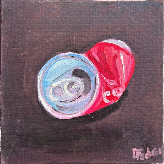A crushed cola can