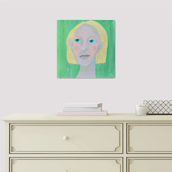 Young and blond soft green woman portrait