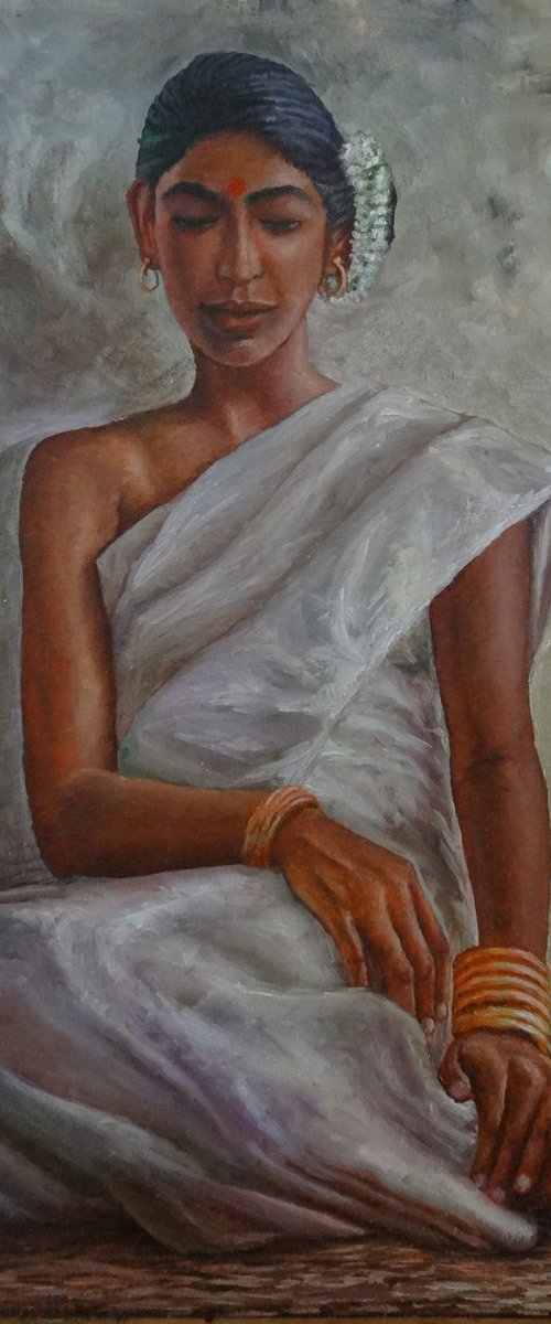 Woman in white saree by Ramya Sadasivam