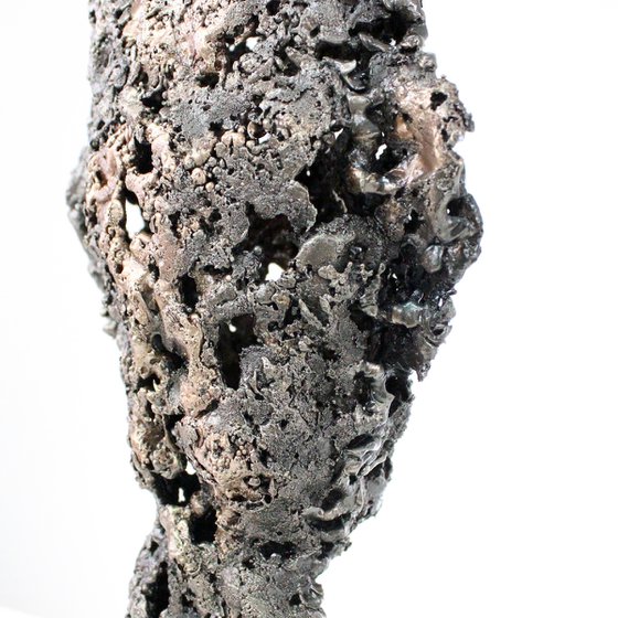 A rock - Face sculpture bronze steel