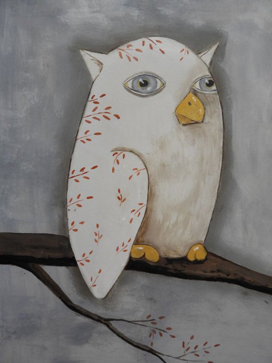 The freaky white owl on the branch