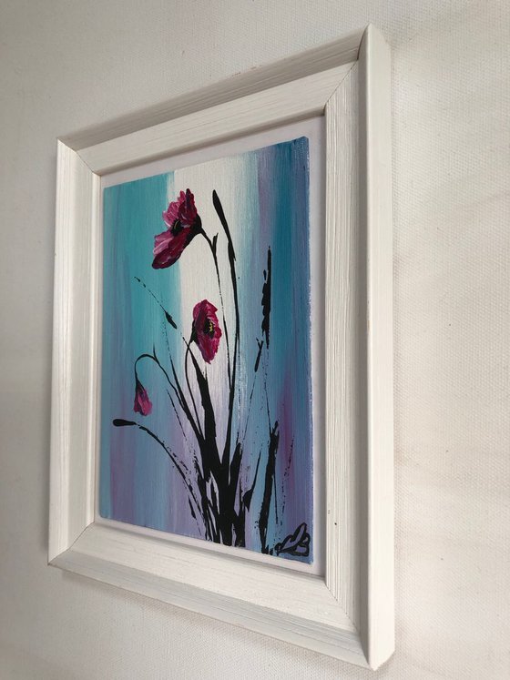 Purple poppies in a frame
