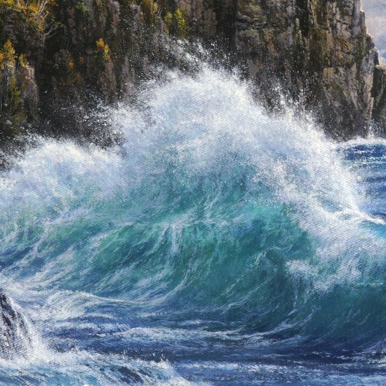 Lighthouse at the edge of the surf