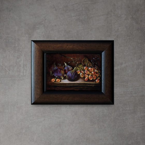 Still life with figs and a bunch of grapes