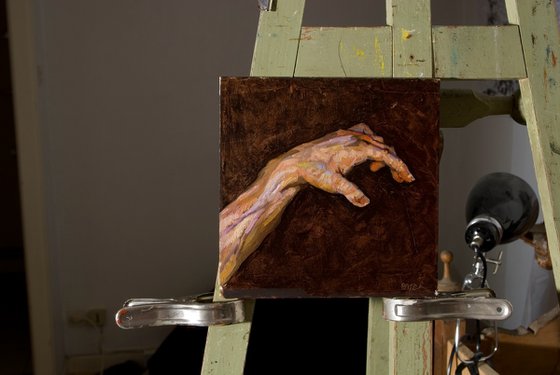 impressionist hand on black background