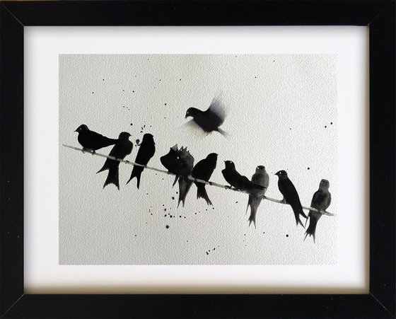 Swallows on a line