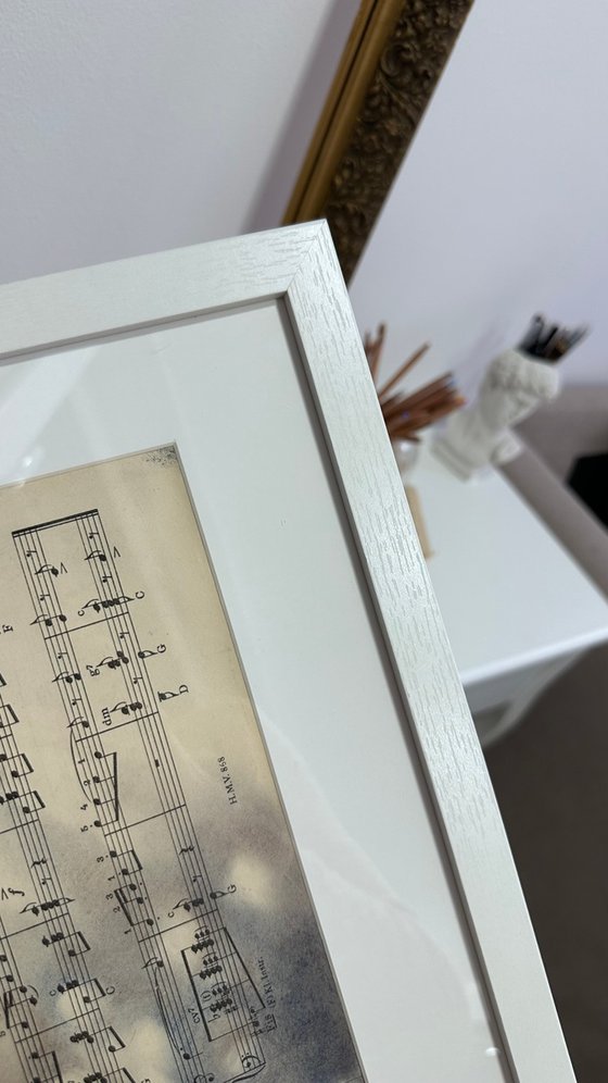 Silhouette Hand And Leaves on Music Sheet