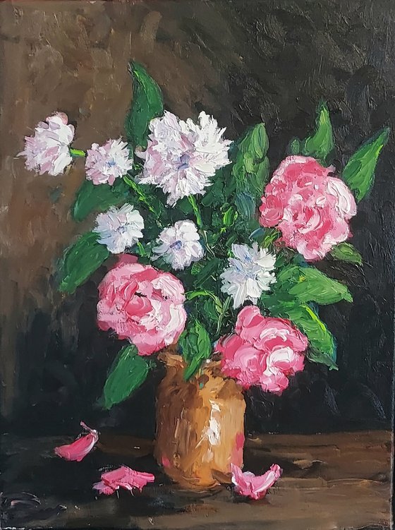 pink and white flowers in earthenware jug