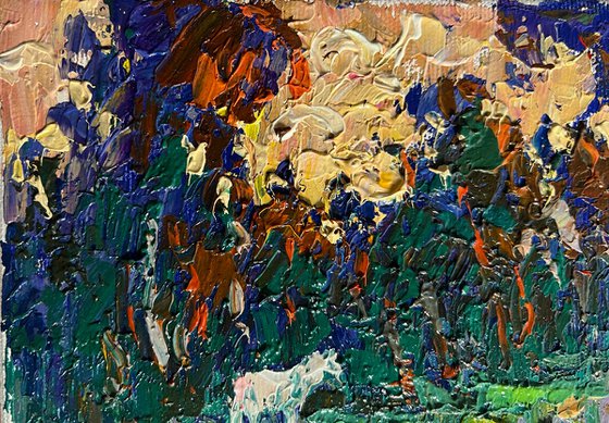 Yellow sunset behind tree