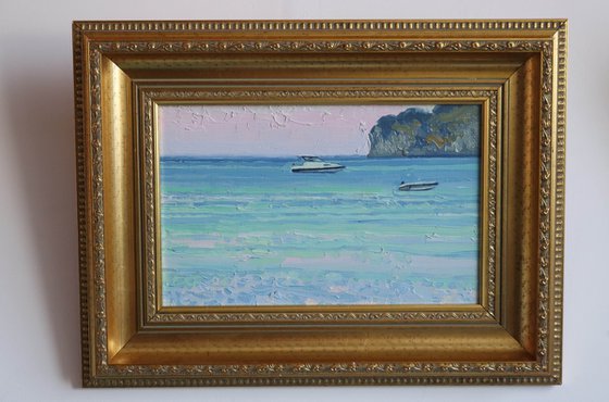 Sunset. Boats on the sea