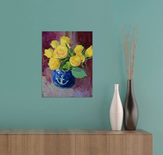 Yellow tulips in a blue vase