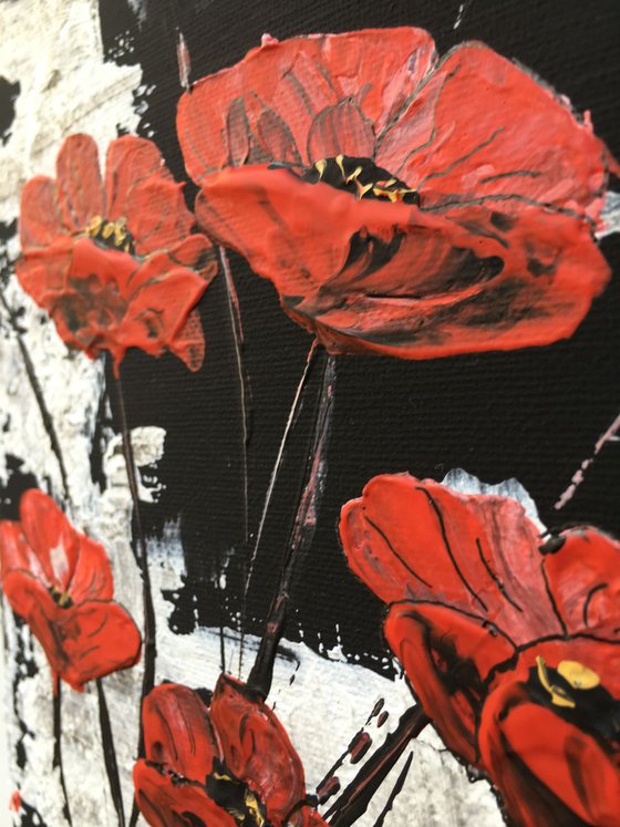 White on black background with red poppies