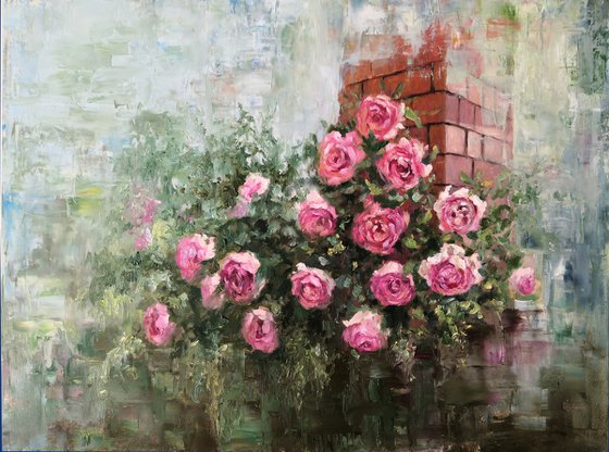 Rose bush on a brick wall background