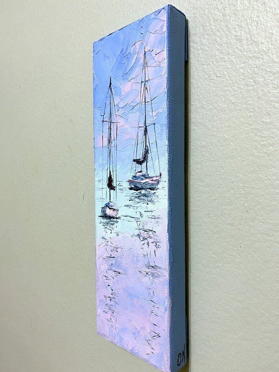 Sailboats at tender sunset