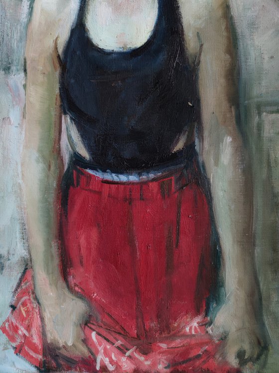 Timid girl in a red skirt