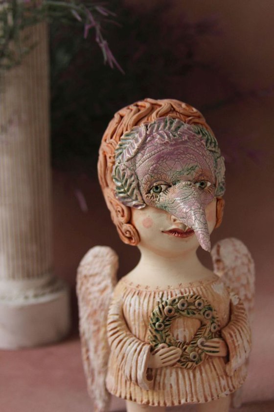 Angel holding a wreath. Ceramic OOAK sculpture.