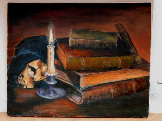 Candle and books.