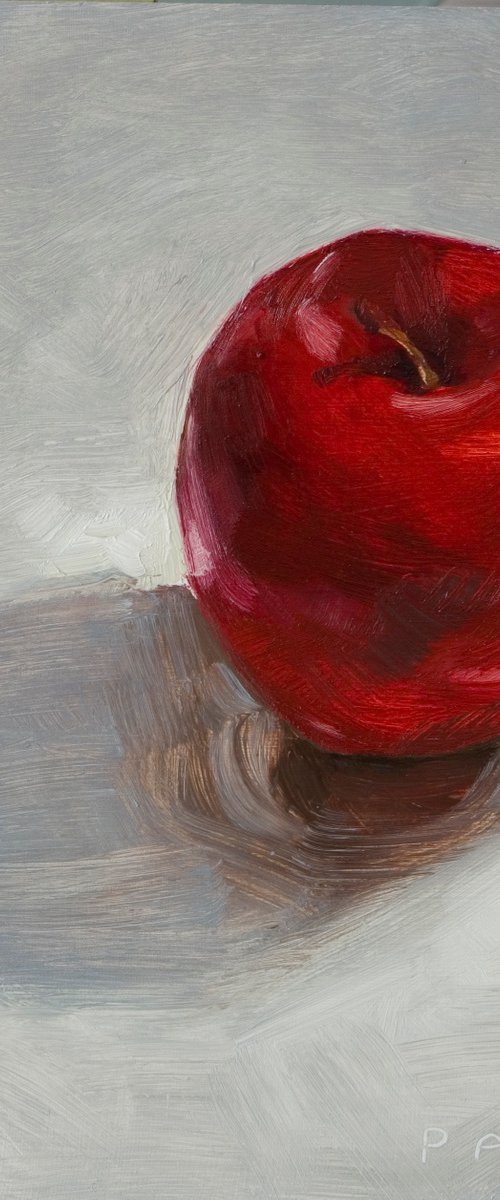 still life of red apple on a white background by Olivier Payeur