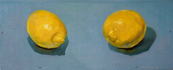 twin yellow lemons on a wood board for food lovers