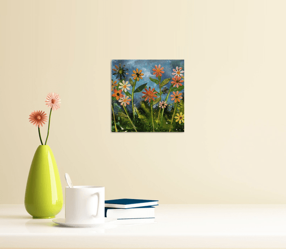 Flower meadow on blue canvas