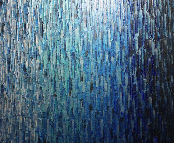Faded silvery white blue-black iridescent