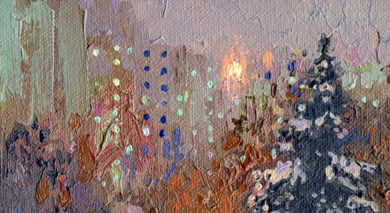 A spruce on a winter boulevard at night