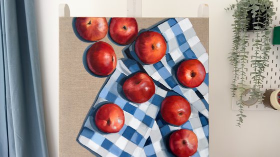 Red apples on a kitchen towel