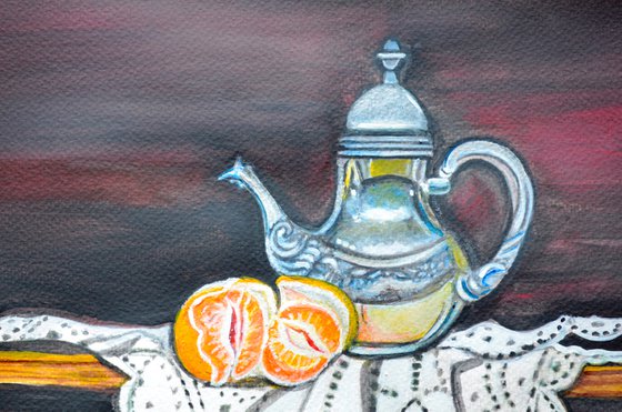 Still life with orange and teapot on lace