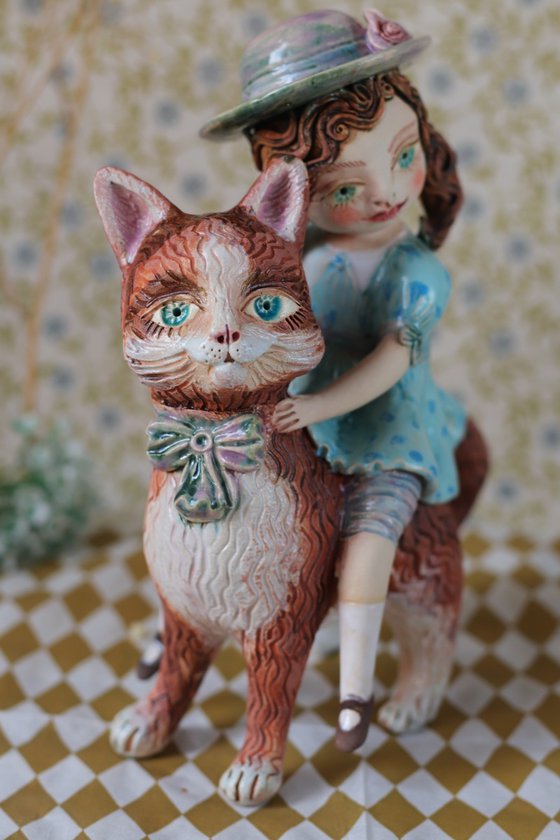 Vintage dressed girl riding a cat.