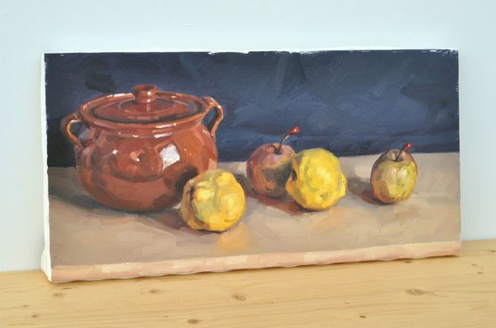 Quinces, passe crassane pears and an earthenware dish